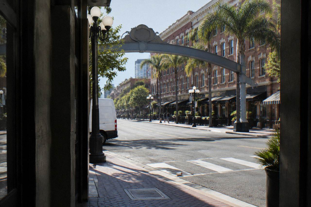 The Gaslamp Quarter Arch sign above a downtown street in the evening