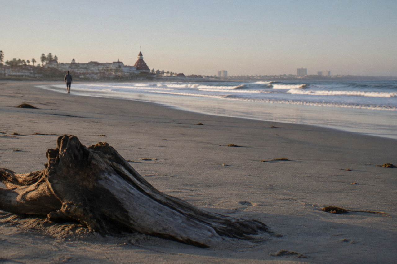Wide Coronado beach with flat open sand and low morning waves