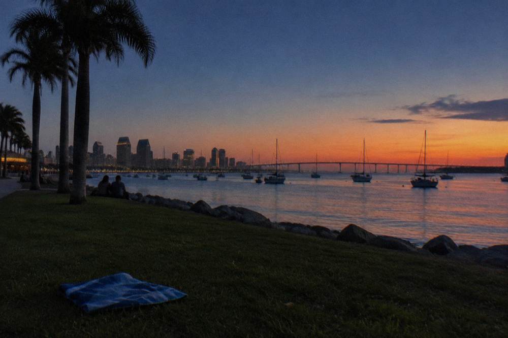 Boats on San Diego Bay at dusk near the waterfront