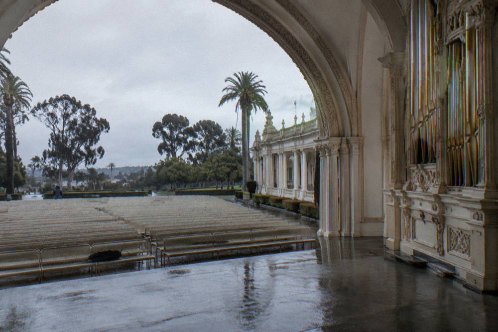 The Spreckels Organ Pavilion stage and rows of seats under an open arched roof