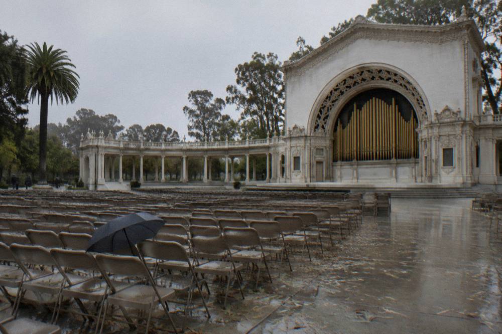 The Spreckels Organ Pavilion stage and rows of seats under an open arcade