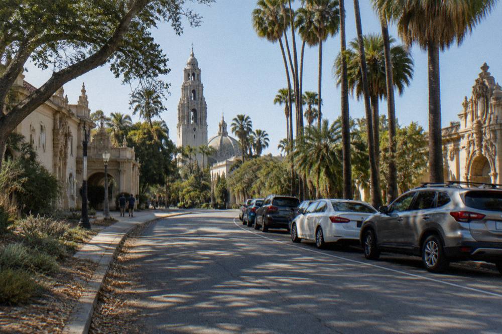 Shaded parking spaces along a tree-lined street in Balboa Park