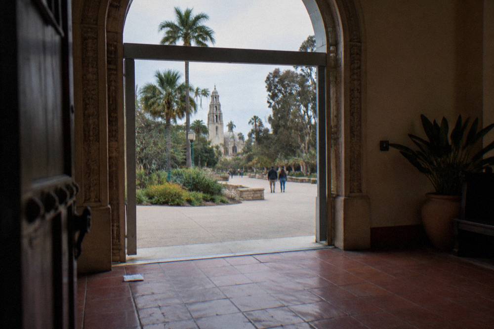 Museum lobby entrance with stone archway and tiled floor