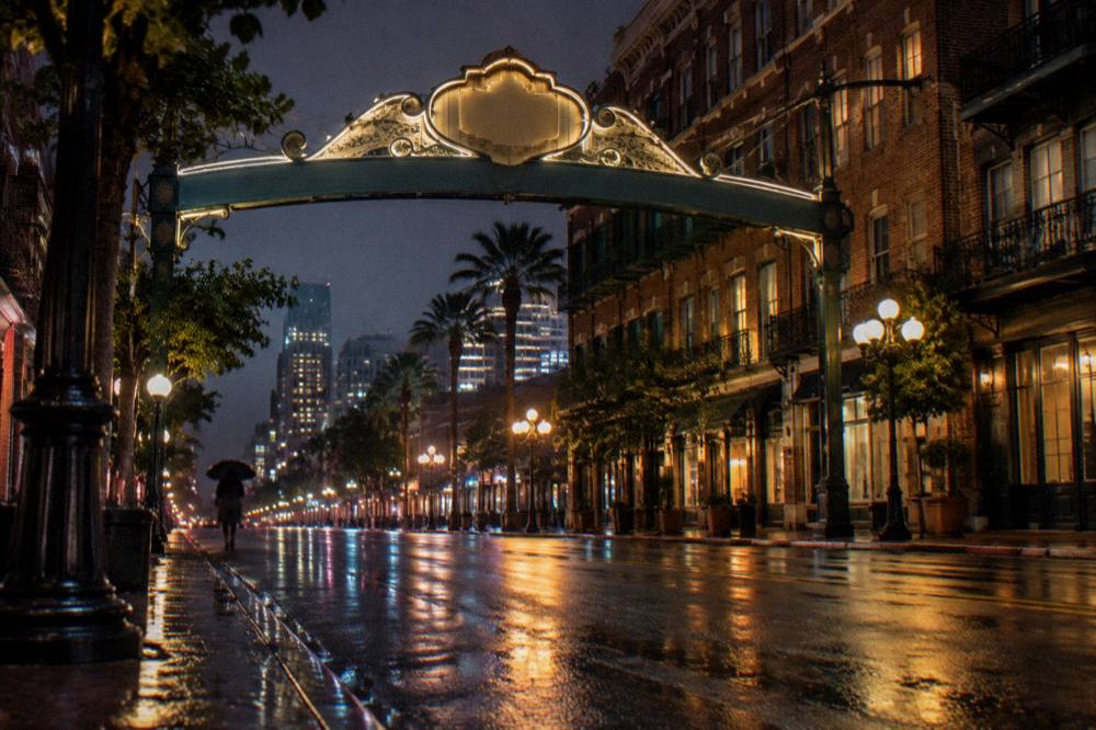 The Gaslamp Quarter sign arch over Fifth Avenue at dusk