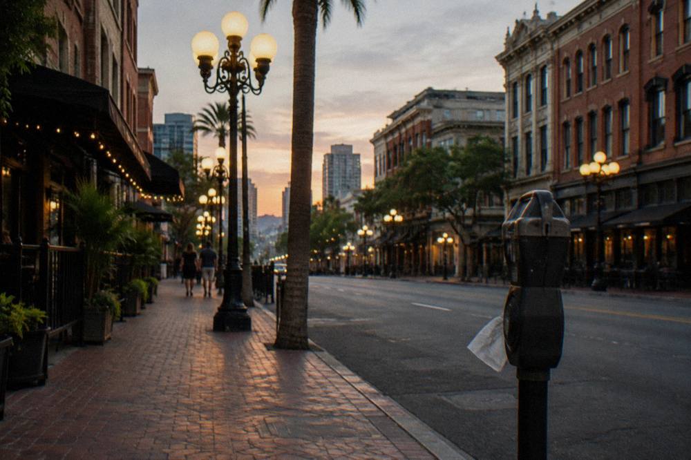 Historic building facades and ornate street lamps along a Gaslamp Quarter street