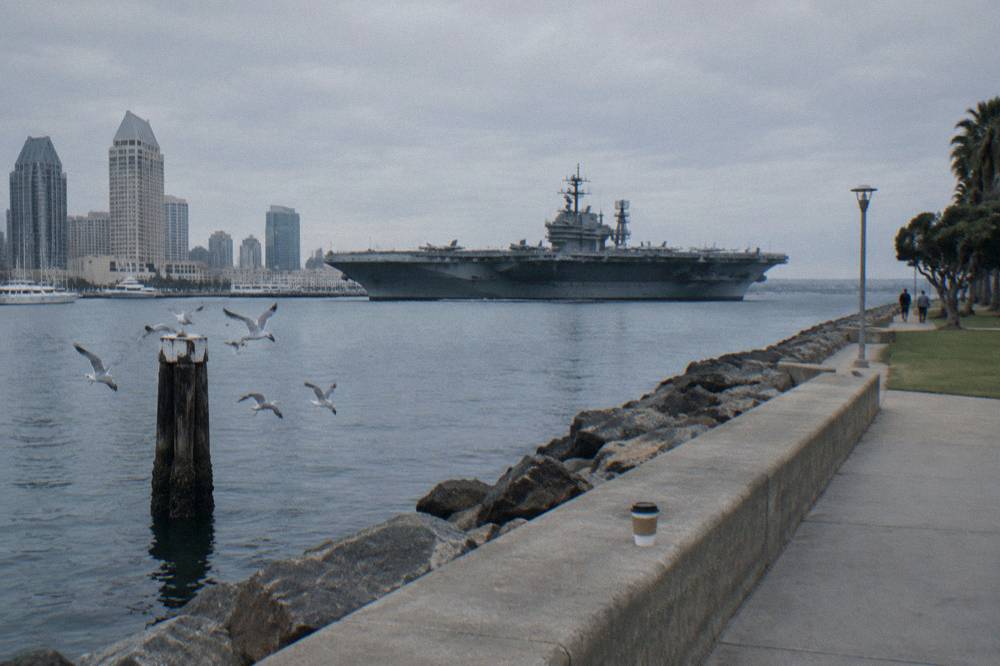 Downtown San Diego harbor waterfront with ships moored along the bay