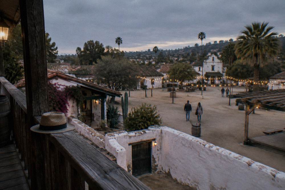 White adobe buildings and a plaza in Old Town San Diego State Historic Park